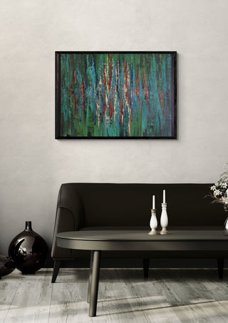Green abstract 2 by Dina in a black frame above a dark sofa with candlesticks