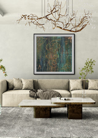 Irish mood by Dina in a black frame above a beige sofa under a branch chandelier