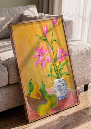 Lillies by Deblina Dey in a walnut frame leaning against a grey sofa