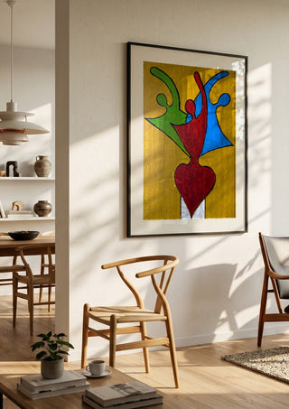 The Synthesis of Sel by Bibi in a black frame in a bright dining room with wooden chairs