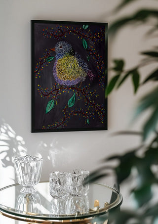 Digital Alchemy by Bibi in a black frame above a glass table with crystal glassware