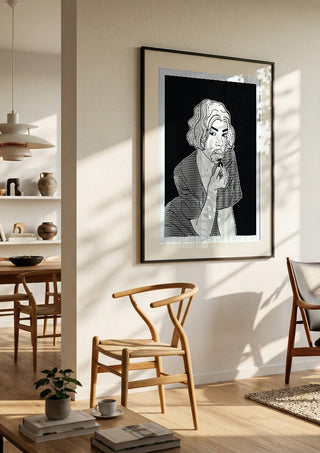 Poppy by Nari in a black frame in a bright dining room with wooden chairs