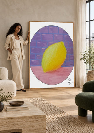 ABCitron by L.OE. Art leaning against a sunlit living room wall beside a woman