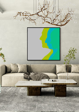 Balance by Tonia in a black frame above a beige sofa under a branch chandelier
