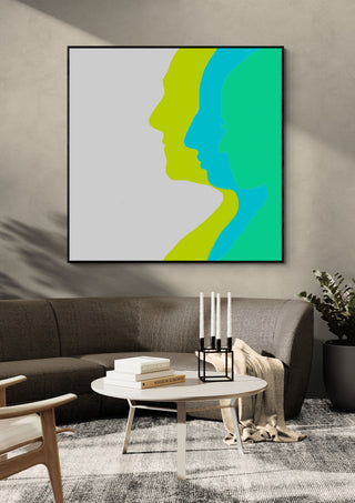 Balance by Tonia in a black frame above a grey sofa with candlesticks