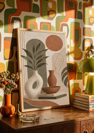 Earth Tone Abstract Still Life by TimlessArtworks in a wooden frame on a sideboard against retro patterned wallpaper