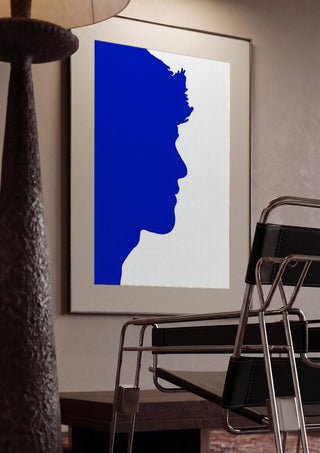 Projected personality by Tonia framed in a dim room beside a tubular steel chair