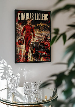Charles Leclerc by Danii Steinfeldt in a black frame above a glass table with crystal glassware