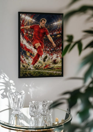 Harry Kane by Danii Steinfeldt in a black frame above a glass table with crystal glassware