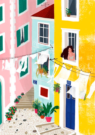 Colorful street scene with laundry hanging, potted plants, and a woman relaxing by an open window.