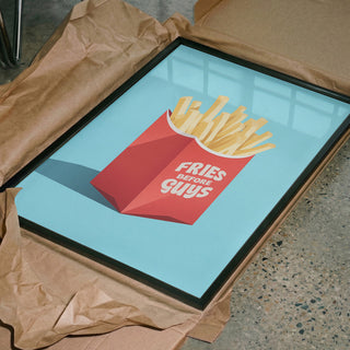Framed "Fries Before Guys" art print by Andreas Magnusson on blue background, displayed in packaging.
