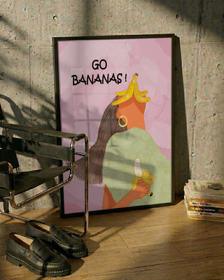 Framed "Go Bananas Playful" art print by Sannel Larson, featuring a woman with bananas on her head and in hand.