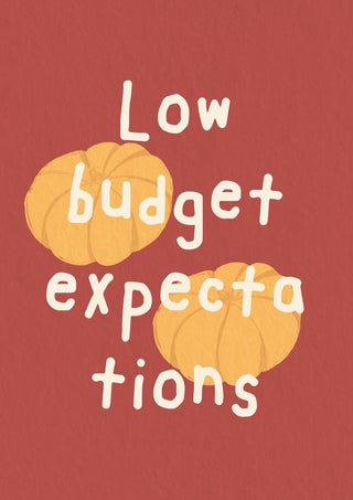 Low Budget Expectations by Jakob Falkenberg - two orange pumpkins and hand-lettered type on brick red