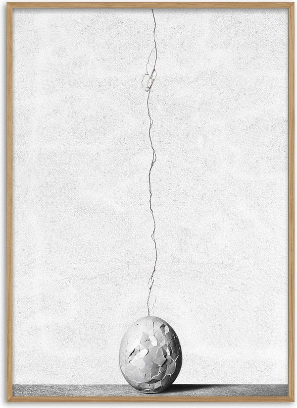 A cracked sphere with a wire extending upward, featured on the Cracks by Giorgio Toniolo product page.