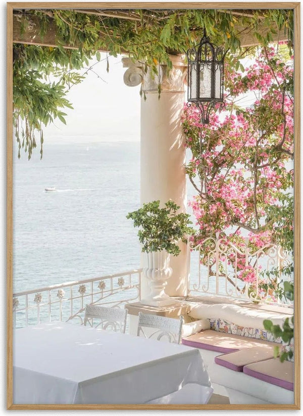 Terrace with flowers and sea view, shaded seating area under pergola at Sorrento Vibes.